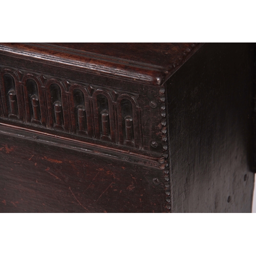 1177 - A 17TH CENTURY OAK PLANK COFFER / SWORD BOX OF LARGE SIZE with moulded edge hinged top fitted with s... 