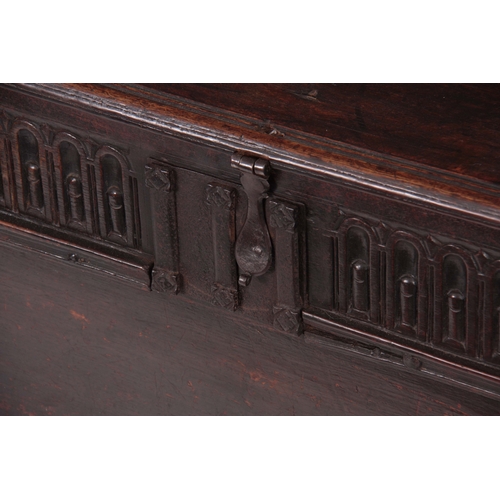 1177 - A 17TH CENTURY OAK PLANK COFFER / SWORD BOX OF LARGE SIZE with moulded edge hinged top fitted with s... 