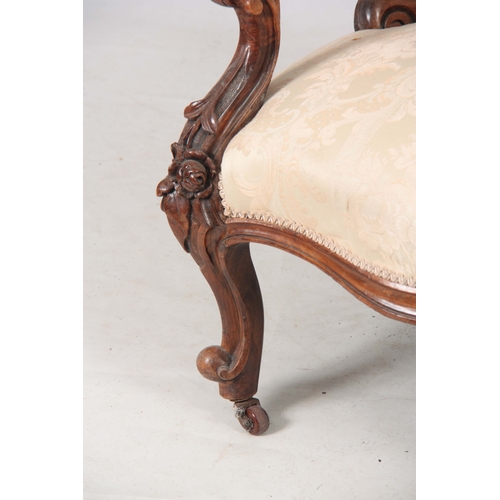 1178 - A VICTORIAN GENTLEMANS CARVED WALNUT BUTTON BACKED DRAWING ROOM CHAIR with carved frame and open arm... 