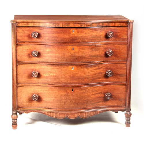 1181 - A GEORGE III MAHOGANY SERPENTINE CHEST OF DRAWERS having four long graduated drawers fitted with tur... 