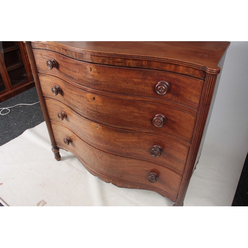 1181 - A GEORGE III MAHOGANY SERPENTINE CHEST OF DRAWERS having four long graduated drawers fitted with tur... 