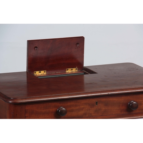 1185 - AN EARLY 19TH CENTURY MAHOGANY WRITING TABLE IN THE MANER OF GILLOWS having a lift-up pen and ink co... 