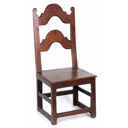 1188 - A LATE 18TH CENTURY JOINED OAK  SIDE CHAIR with arched splat back and  plank seat; standing on squar... 