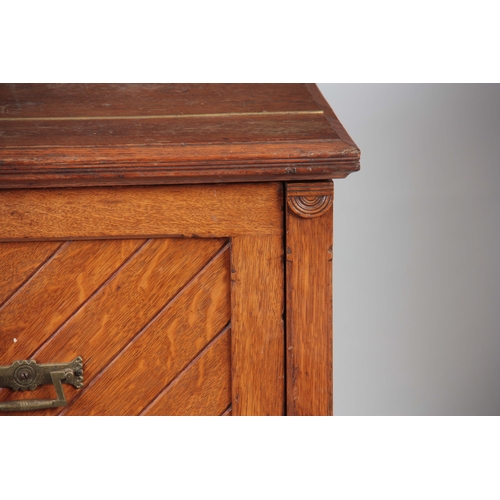 1192 - AN UNUSUAL LATE 19TH CENTURY OAK SECRETAIRE CHEST with a grooved panelled front fitted with aestheti... 