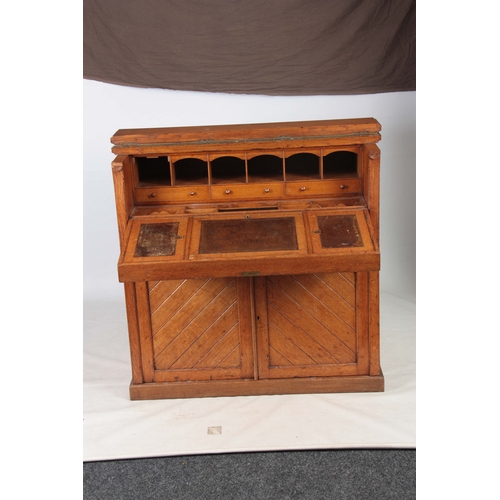 1192 - AN UNUSUAL LATE 19TH CENTURY OAK SECRETAIRE CHEST with a grooved panelled front fitted with aestheti... 