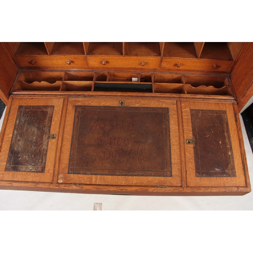 1192 - AN UNUSUAL LATE 19TH CENTURY OAK SECRETAIRE CHEST with a grooved panelled front fitted with aestheti... 