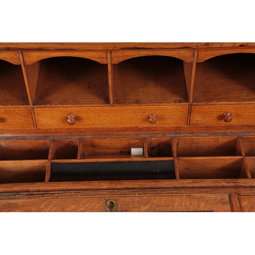 1192 - AN UNUSUAL LATE 19TH CENTURY OAK SECRETAIRE CHEST with a grooved panelled front fitted with aestheti... 