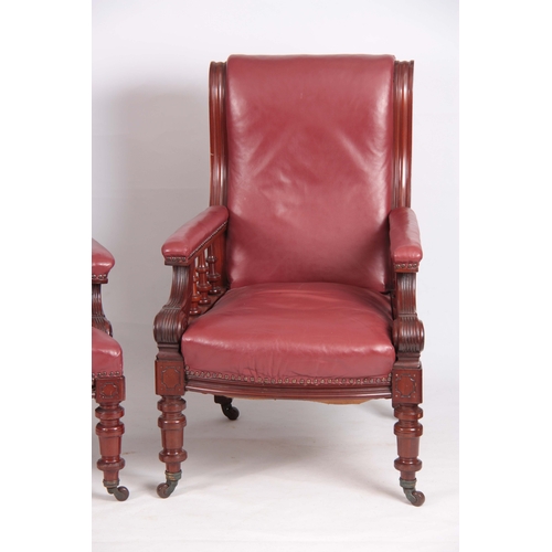 1194 - A PAIR OF LATE 19TH CENTURY MAHOGANY RED LEATHERED ARMCHAIRS with shaped backs and open arms support... 