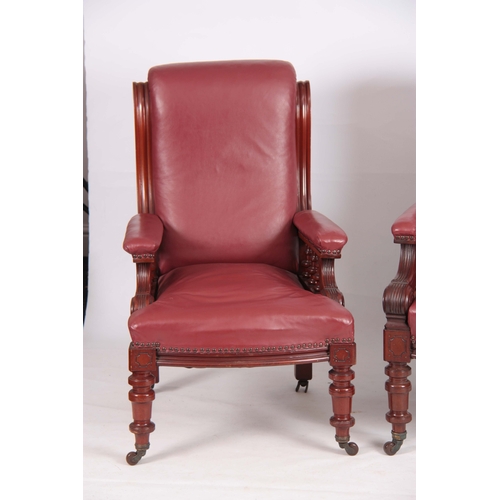 1194 - A PAIR OF LATE 19TH CENTURY MAHOGANY RED LEATHERED ARMCHAIRS with shaped backs and open arms support... 