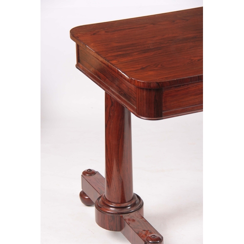 1195 - A WILLIAM IV ROSEWOOD LIBRARY TABLE with rounded corners above two frieze drawers; standing on turne... 