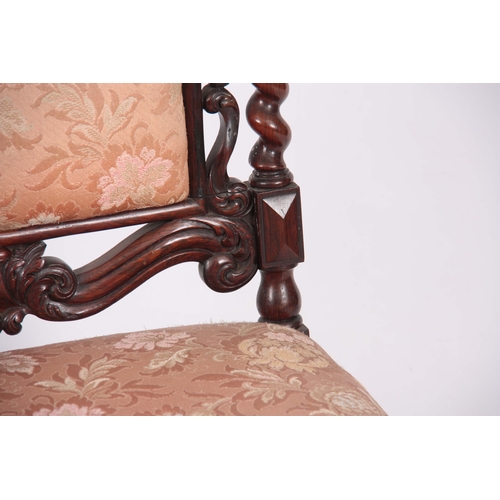 1197 - A MID VICTORIAN ROSEWOOD UPHOLSTERED ROSEWOOD NURSING CHAIR with leaf carved top rail, barley twist ... 