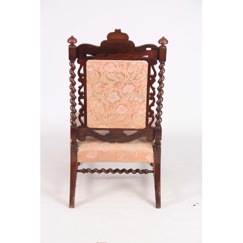 1197 - A MID VICTORIAN ROSEWOOD UPHOLSTERED ROSEWOOD NURSING CHAIR with leaf carved top rail, barley twist ... 