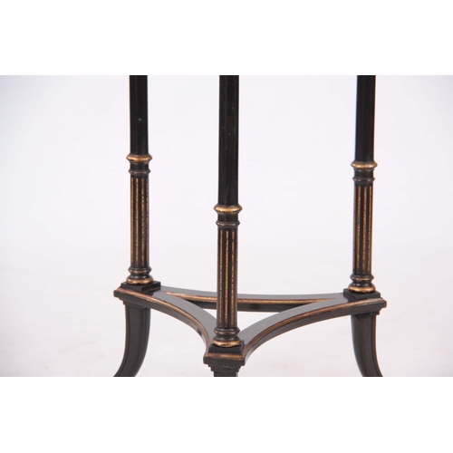 1202 - A STYLISH LATE 19TH CENTURY GILT AND EBONISED OCCASIONAL TABLE having an inlaid border to the top de... 