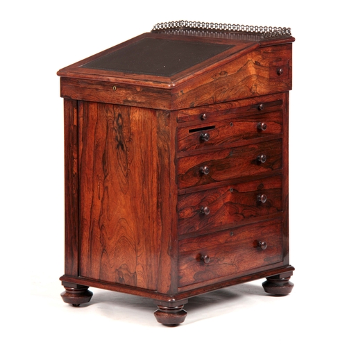 1203 - AN EARLY 19TH CENTURY ROSEWOOD DAVENPORT the top section with brass gallery and angled leather writi... 