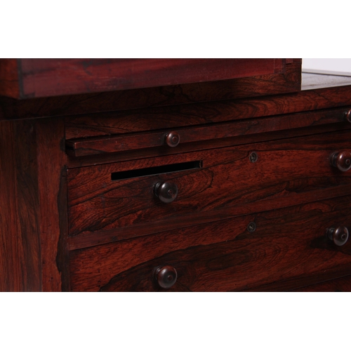 1203 - AN EARLY 19TH CENTURY ROSEWOOD DAVENPORT the top section with brass gallery and angled leather writi... 