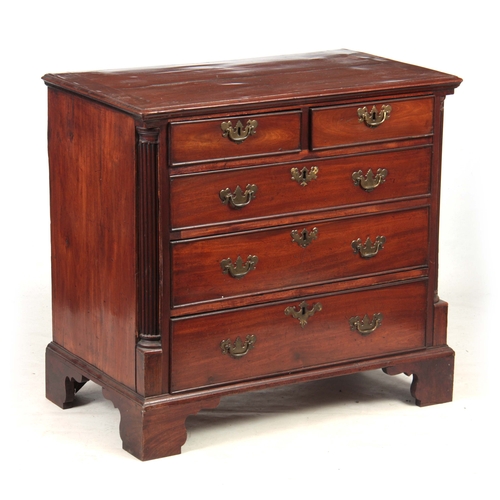 1205 - A GEORGE III MAHOGANY LANCASHIRE CHEST OF DRAWERS with quarter column sides flanking two small and t... 