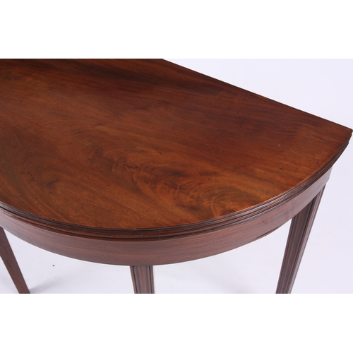 1220 - A GEORGE III FLAMED MAHOGANY 'D' SHAPED TEA TABLE with hinged moulded edge top, boxwood inlaid friez... 