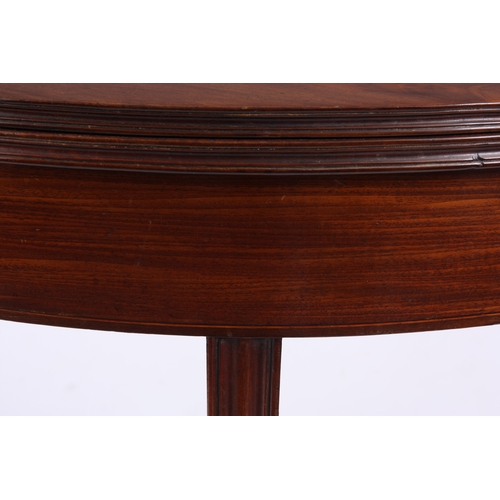 1220 - A GEORGE III FLAMED MAHOGANY 'D' SHAPED TEA TABLE with hinged moulded edge top, boxwood inlaid friez... 