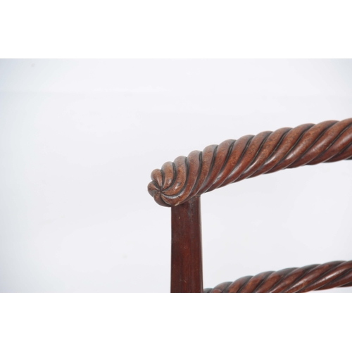 1223 - AN EARLY 19TH CENTURY MAHOGANY MUSIC CHAIR POSSIBLY IRISH with rope twist shaped top rail above a re... 