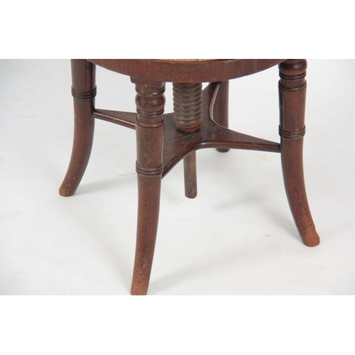 1223 - AN EARLY 19TH CENTURY MAHOGANY MUSIC CHAIR POSSIBLY IRISH with rope twist shaped top rail above a re... 