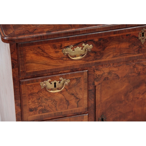 1227 - A GEORGE I HERRING-BANDED BURR WALNUT KNEEHOLE DESK with moulded edge top and rounded corners above ... 