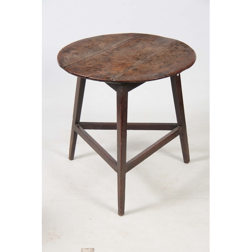 1229 - AN 18TH CENTURY OAK CRICKET TABLE with three plank circular top above a tripod base with tapering le... 