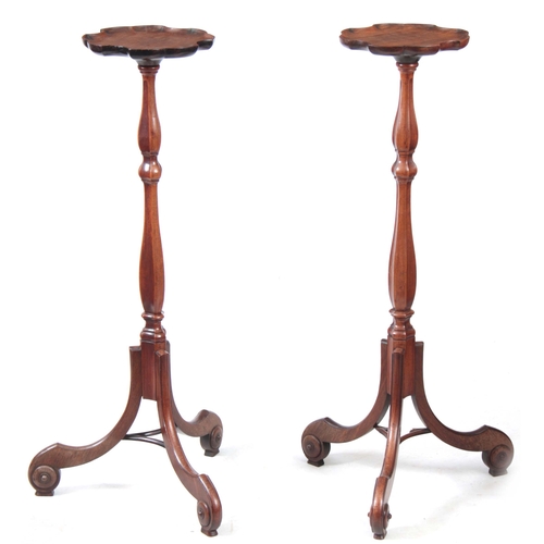 1233 - A PAIR OF GEORGE III MAHOGANY HEPPLEWHITE STYLE TORCHERES / CANDLESTANDS of shaped design standing o... 