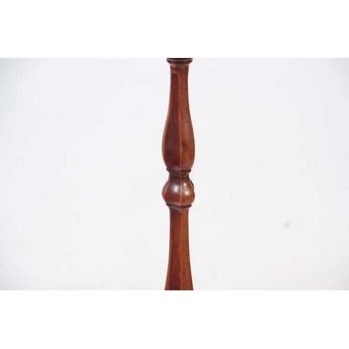 1233 - A PAIR OF GEORGE III MAHOGANY HEPPLEWHITE STYLE TORCHERES / CANDLESTANDS of shaped design standing o... 