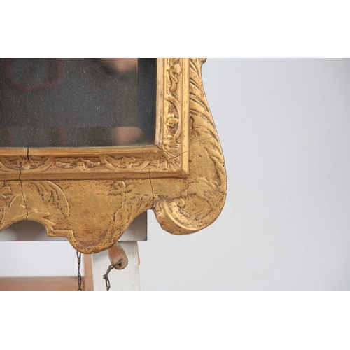 1238 - A GEORGE II GILT GESO HANGING MIRROR OF GENEROUS SIZE with a bevelled plate and leaf moulded border ... 