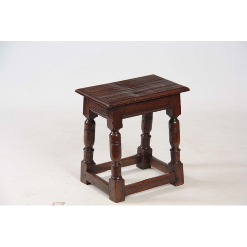 1242 - A LATE 17th CENTURY OAK JOINT STOOL with pegged moulded edge top above bulbous ring-turned legs join... 