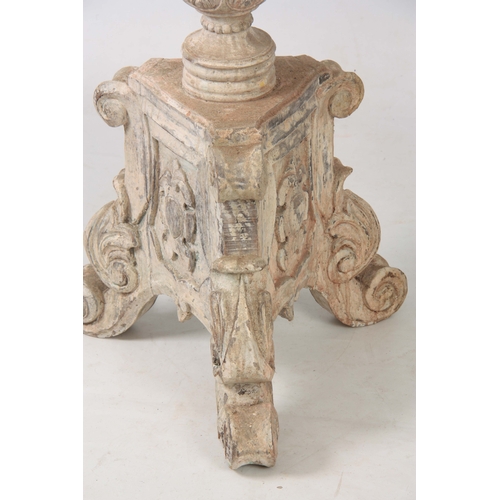 1243 - A LARGE PAIR OF CONTINENTAL CARVED PAINTED TORCHERES having acanthus leaf and gadrooned stems with c... 