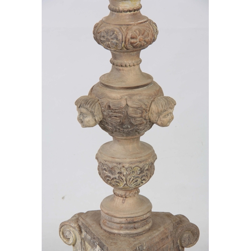 1243 - A LARGE PAIR OF CONTINENTAL CARVED PAINTED TORCHERES having acanthus leaf and gadrooned stems with c... 