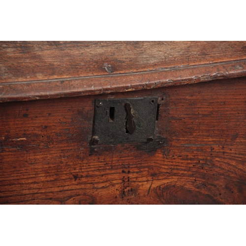 1244 - AN 18TH CENTURY ELM SIX PLANK SWORD BOX with hinged lid and iron-bound lock; standing on shaped end ... 