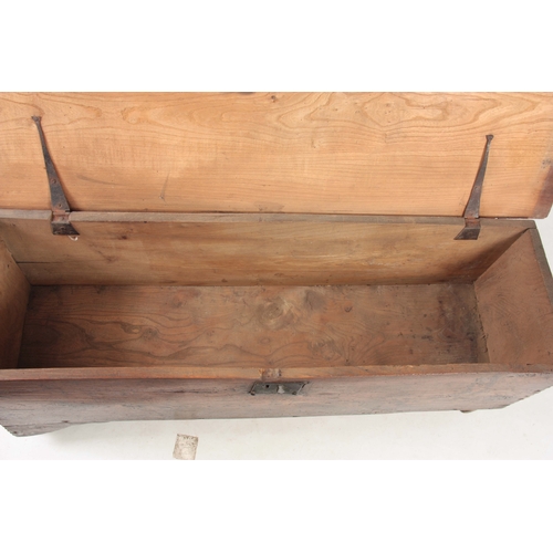 1244 - AN 18TH CENTURY ELM SIX PLANK SWORD BOX with hinged lid and iron-bound lock; standing on shaped end ... 