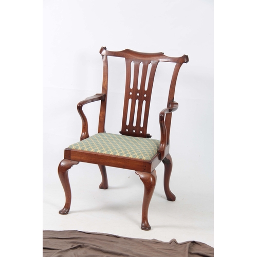 1245 - AN EARLY GEORGE III FIGURED MAHOGANY ARMCHAIR OF GENEROUS PROPORTIONS with shaped top rail and scrol... 