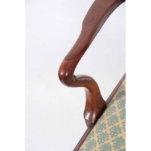 1245 - AN EARLY GEORGE III FIGURED MAHOGANY ARMCHAIR OF GENEROUS PROPORTIONS with shaped top rail and scrol... 