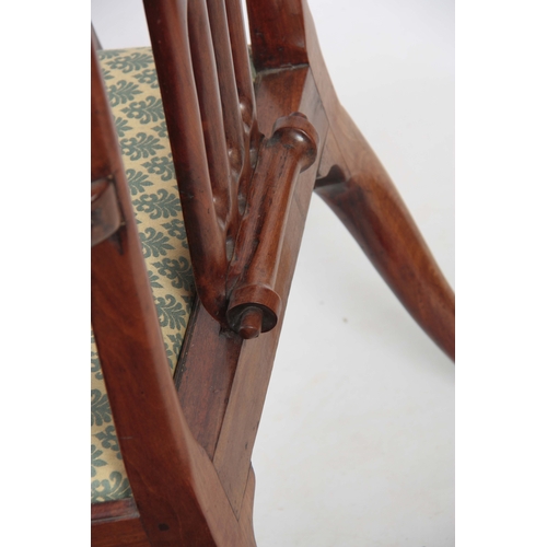 1245 - AN EARLY GEORGE III FIGURED MAHOGANY ARMCHAIR OF GENEROUS PROPORTIONS with shaped top rail and scrol... 