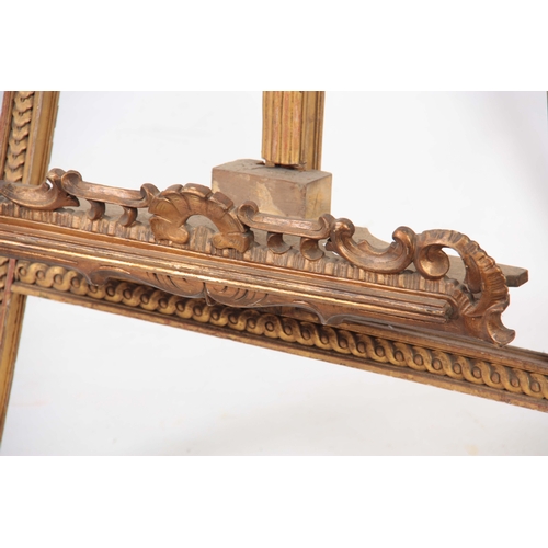 1246 - A WILLIAM IV CARVED GILT GESSO LIAR SHAPED EASEL with adjustable sliding rest and hinged back suppor... 