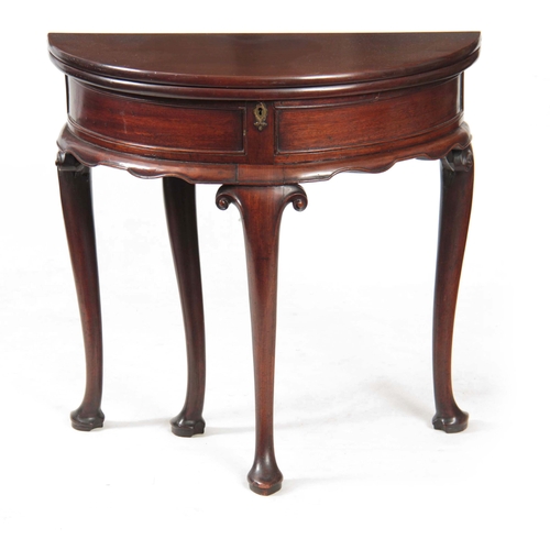 1247 - AN EARLY GEORGE III MAHOGANY DEMI LUME SHAPED TILT TOP TEA TABLE the double-hinged top revealing a p... 