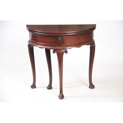 1247 - AN EARLY GEORGE III MAHOGANY DEMI LUME SHAPED TILT TOP TEA TABLE the double-hinged top revealing a p... 