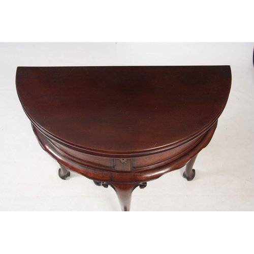 1247 - AN EARLY GEORGE III MAHOGANY DEMI LUME SHAPED TILT TOP TEA TABLE the double-hinged top revealing a p... 