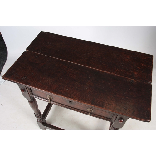 1249 - A GOOD 17TH CENTURY OAK SIDE TABLE OF SUPERB COLOUR AND PATINA having fruitwood medallions to each c... 