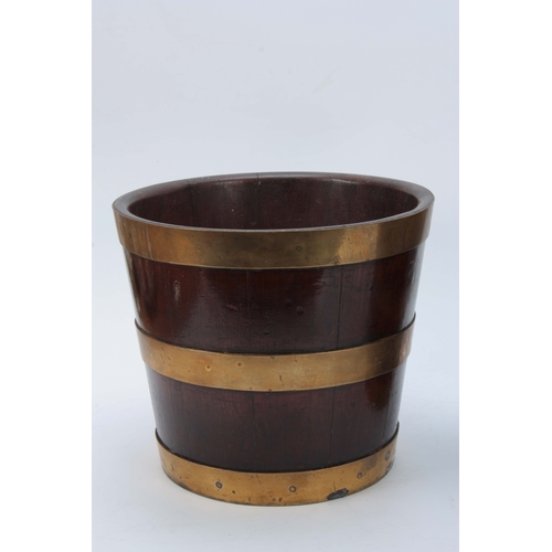 1252 - A PAIR OF GEORGE III BRASS BOUND MAHOGANY BUCKETS of coopered tapering form 25cm high 29cm diameter.