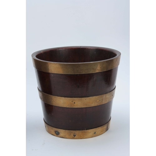 1252 - A PAIR OF GEORGE III BRASS BOUND MAHOGANY BUCKETS of coopered tapering form 25cm high 29cm diameter.