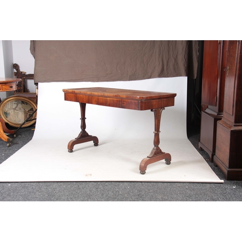 1254 - A WILLIAM IV FIGURED ROSEWOOD LIBRARY TABLE with carved shaped end supports and plinth bases with un... 