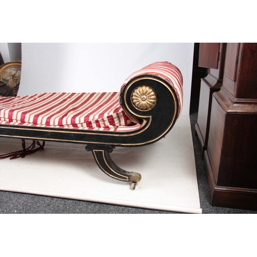 1256 - AN EARLY 19TH CENTURY REGENCY EBONISED AND GILT WORK DAY BED having scrolled ends and splayed legs w... 