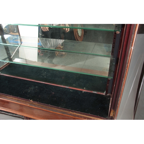 1263 - A 19TH CENTURY MAHOGANY SHOP KEEPERS DISPLAY CABINET with hinged glazed doors enclosing a fitted mir... 