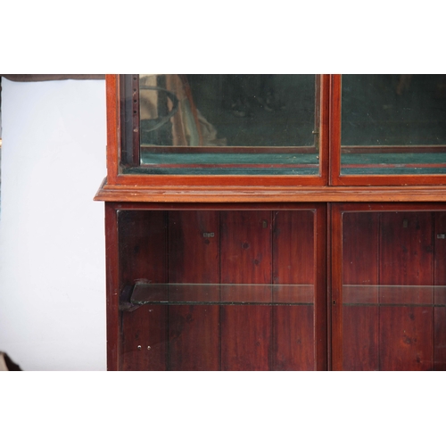 1263 - A 19TH CENTURY MAHOGANY SHOP KEEPERS DISPLAY CABINET with hinged glazed doors enclosing a fitted mir... 