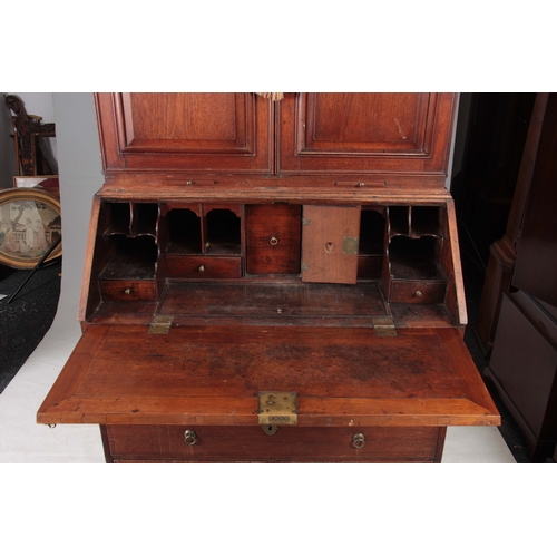 1267 - A WILLIAM AND MARY WALNUT BUREAU BOOKCASE the double-domed top with fielded panelled doors revealing... 