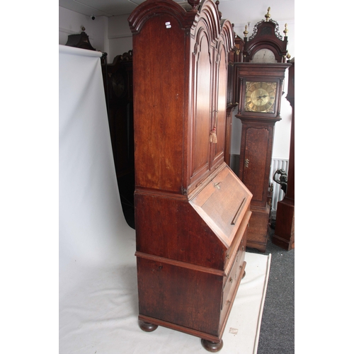 1267 - A WILLIAM AND MARY WALNUT BUREAU BOOKCASE the double-domed top with fielded panelled doors revealing... 